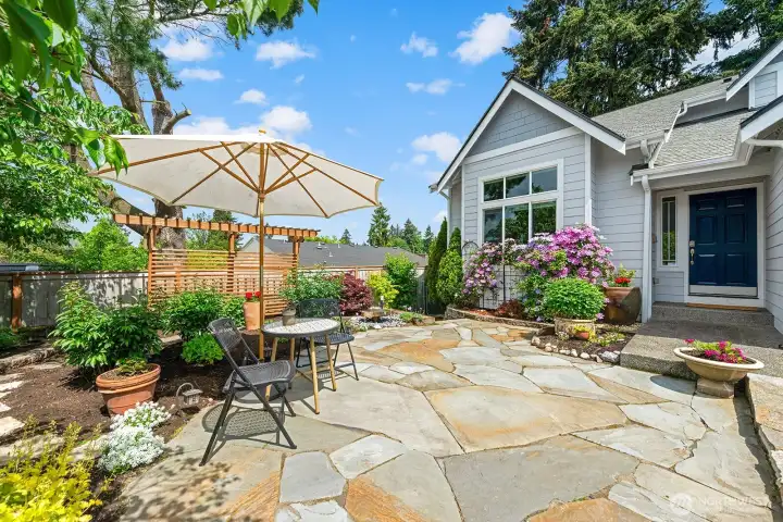 Sun-drenched flagstone patio greets you home. Sun-drenched flagstone patio greets you home.
