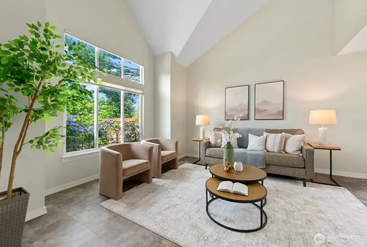 Vaulted living room, UV-protected windows & lush western garden views. Vaulted living room, UV-protected windows & lush western garden views.