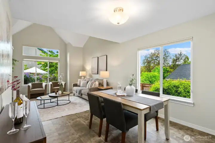 Dining room has sweeping garden views & effortlessly flows to the kitchen. Dining room has sweeping garden views & effortlessly flows to the kitchen.