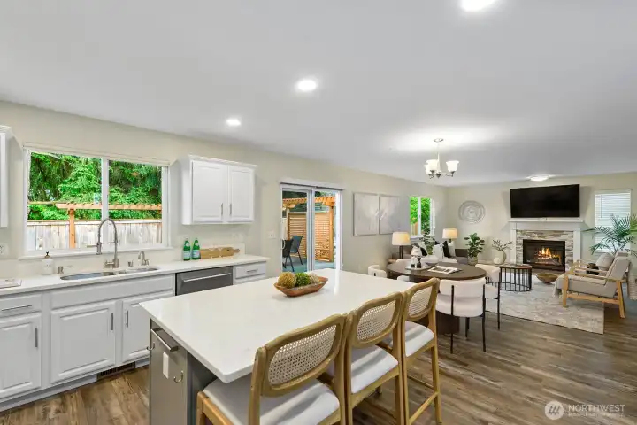 Enlarged quartz island with barstool seating & open to large family room. Enlarged quartz island with barstool seating & open to large family room.