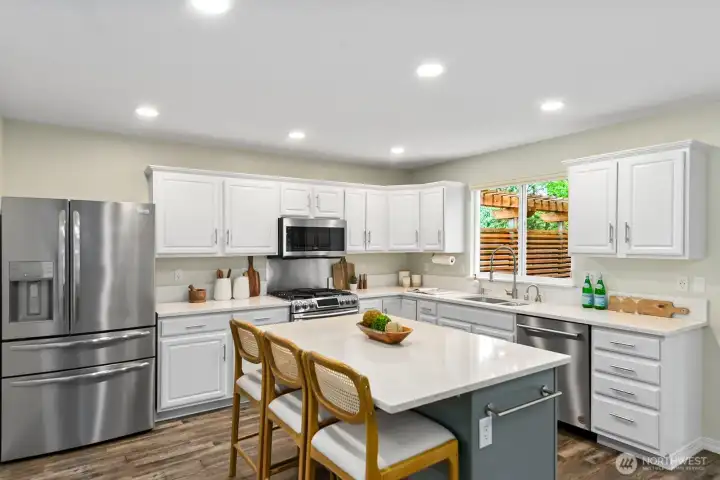 All-quartz counters, chef's will delight with this gas range & counter-depth stainless fridge. All-quartz counters, chef's will delight with this gas range & counter-depth stainless fridge.