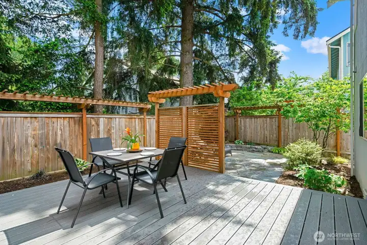Trex deck with pergola, outdoor dining & towering Pacific Northwest pines. Trex deck with pergola, outdoor dining & towering Pacific Northwest pines.