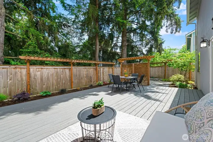 Expansive 25-ft Trex deck with multiple outdoor living & dining areas. Expansive 25-ft Trex deck with multiple outdoor living & dining areas.
