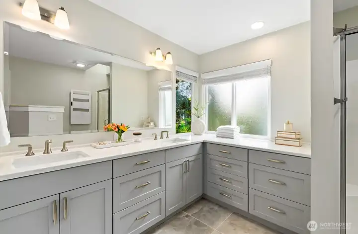 Fully remodeled ensuite with dual vanity, quartz counters & room for a soaker tub if desired. Fully remodeled ensuite with dual vanity, quartz counters & room for a soaker tub if desired.