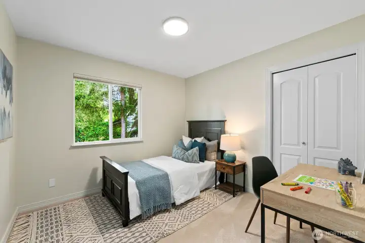 Cozy bedroom with double closet, plush carpet & tranquil tree views. Cozy bedroom with double closet, plush carpet & tranquil tree views.