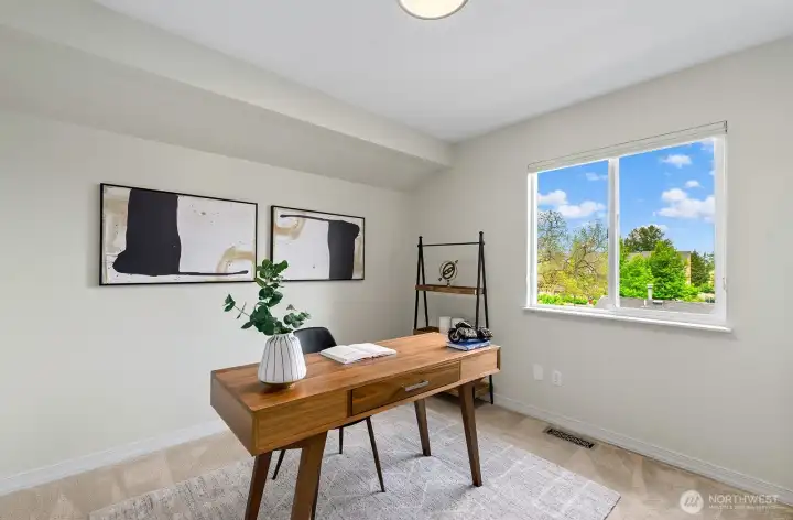 Versatile bedroom or home office with plush carpet & sunny sky views. Versatile bedroom or home office with plush carpet & sunny sky views.