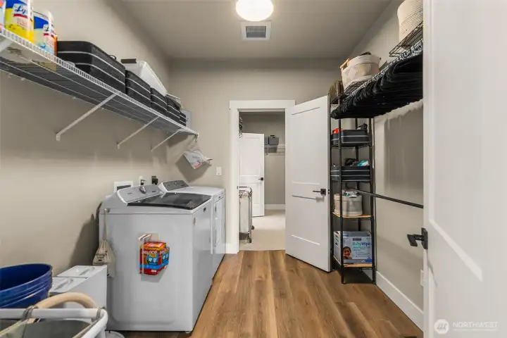Laundry room on the upper level, attached to the primary closet. Laundry room on the upper level, attached to the primary closet.