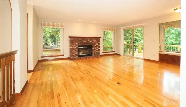 Family room off kitchen window seat on right, slider to deck.
