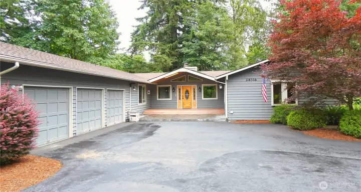 Circular drive to main entrance and 3 car garage.