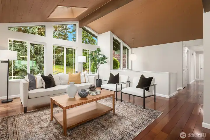 Floor to ceiling windows floors home with natural light.