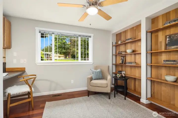 1 of 3 bedrooms on the main level. Custom wood shelving.