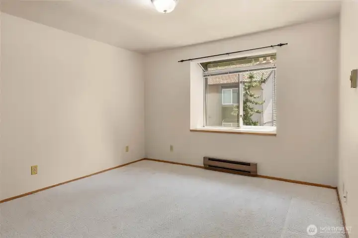 The bedroom is a great size with a sweet bay window and custom closet!
