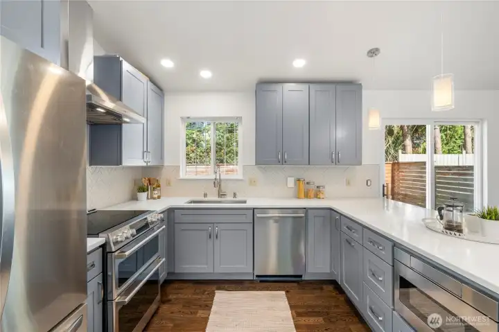Renovated kitchen in 2025 with stainless appliances and tile backsplash.