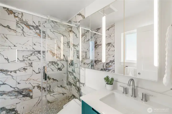 Custom primary bath updated in 2025 with walk in shower.