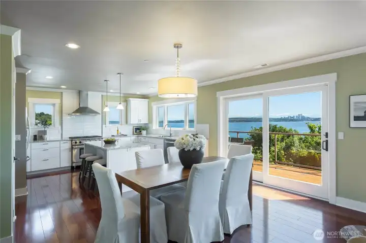 The kitchen and dining area opens directly out to the large deck with TREX decking and glass paneling that allows for unhindered views of the lake and private backyard as well as durability and low maintenence.