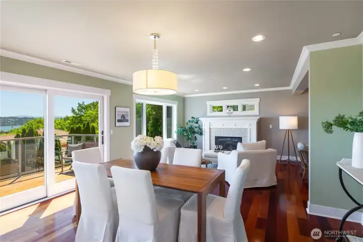 View from the dining area to the gas fireplace with custom tile, mantle and casework.