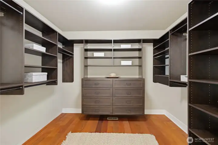 Primary bedroom walk-in closet with built-ins