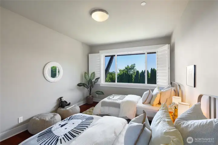 One of two bright and generously sized additional bedrooms.