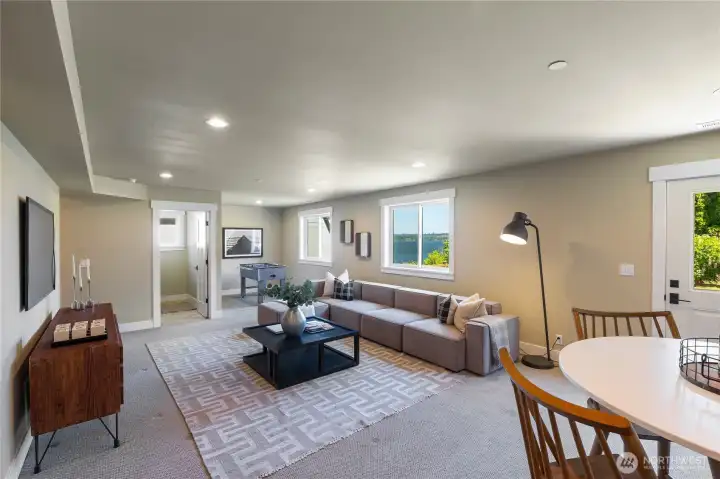The lower level also houses the laundry and mechanical rooms and also offers walk-out access to the fenced back yard gardens full of Lilacs, Dogwood, Japanese Maples and more. Several large "dry storage" rooms are located in the lower portion of the home with secure, outside access.