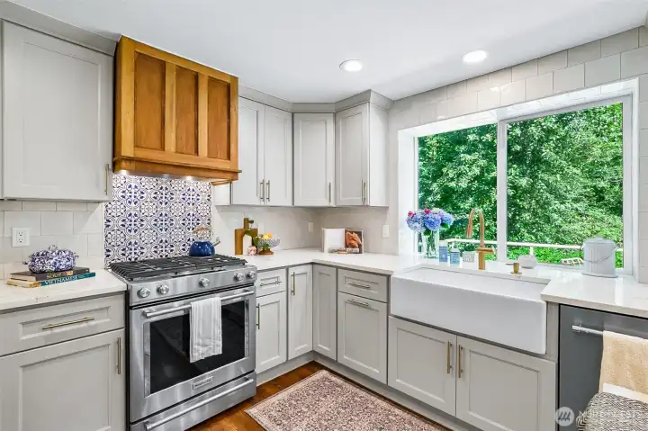 Gorgeous custom Wood Stove Hood and Blue and White Backsplash