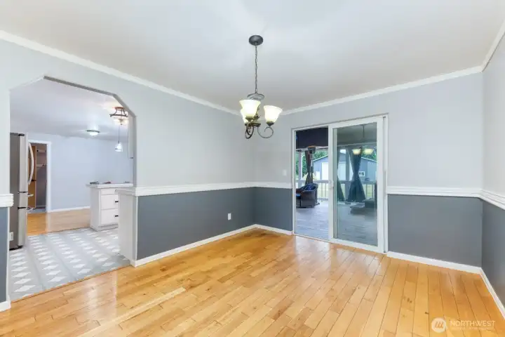 Dining Area with Access to Living, Kitchen and Covered Deck