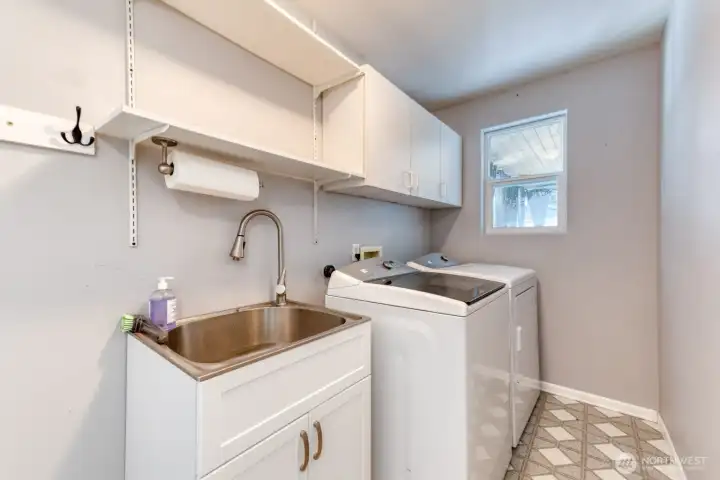 Laundry Room with Access to Kitchen and Garage