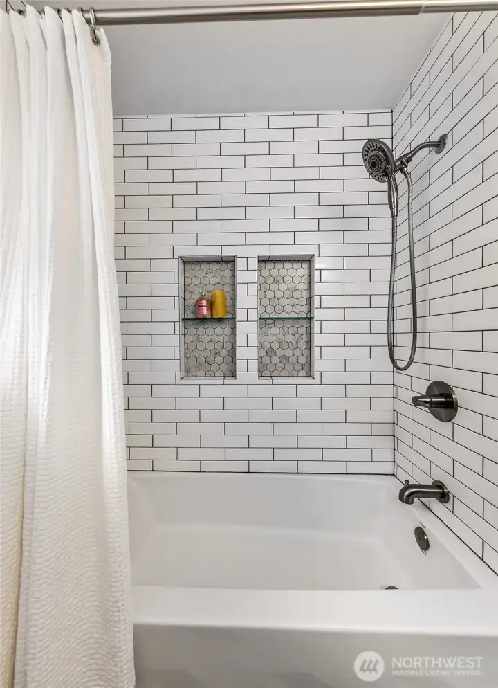 Exquisite tiling in the bathroom on the main floor. Exquisite tiling in the bathroom on the main floor.