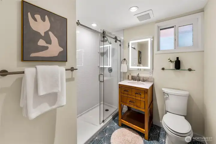 Nicely remodeled downstairs bathroom. Nicely remodeled downstairs bathroom.