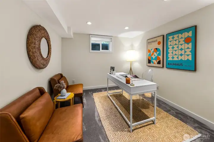 4th bedroom in the basement staged as an office. 4th bedroom in the basement staged as an office.