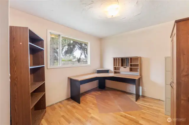 Beautiful hardwood floors adorn guest bedroom