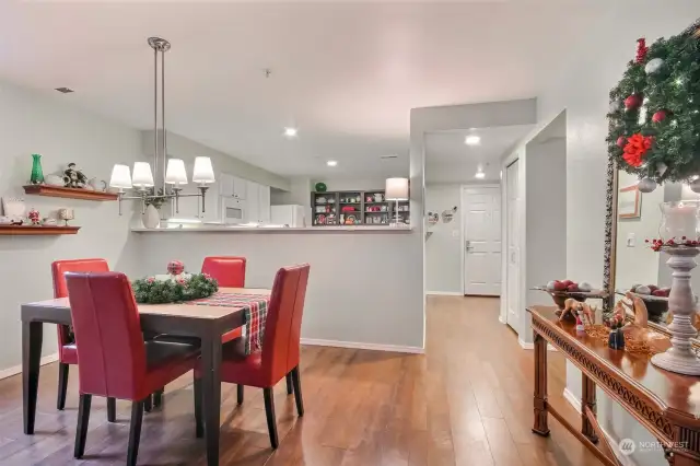 Formal dining with hand scraped engineered hardwood floors.