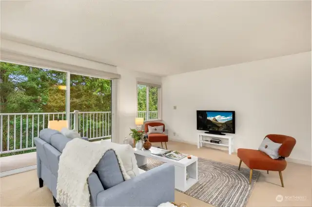 Spacious living room with new carpet and paint