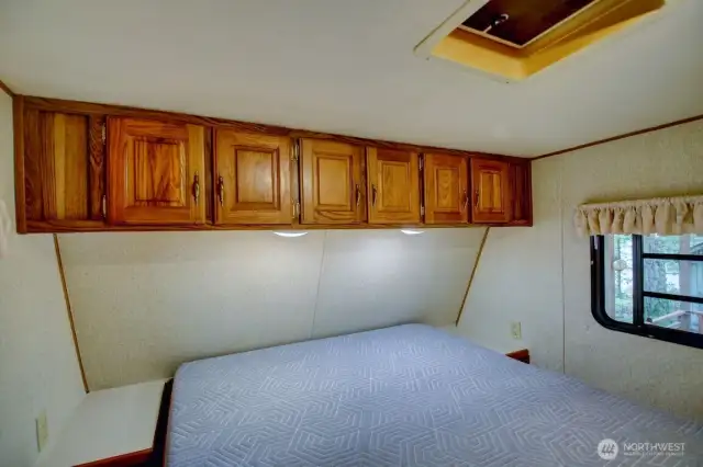 Bedroom with above bed storage