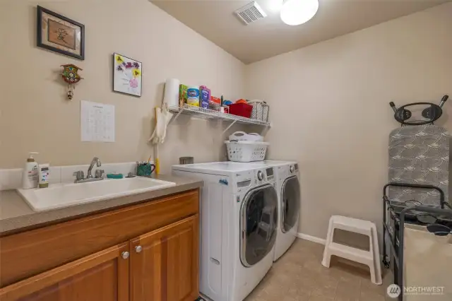 Upper floor utility room with sink