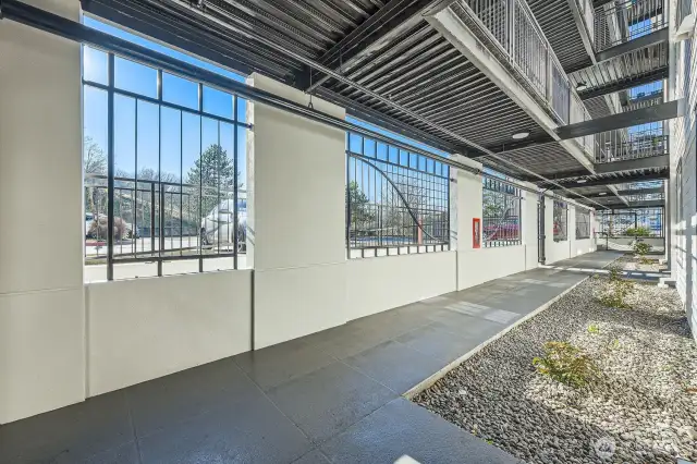 Ground level home with covered walkway.
