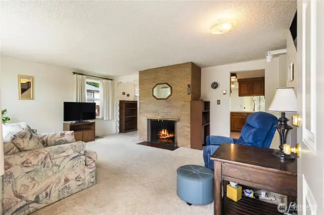 Spacious living room, Hardwoods under carpets, Wood burning fireplace