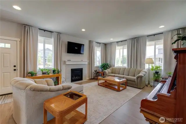 Large open concept with gas fireplace.