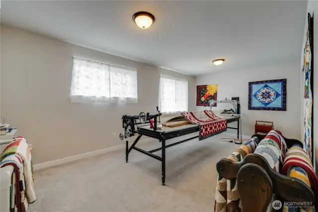 LARGE Bonus room or 5th bedroom. For an idea on size, that piece of equipment needs 14 feet!