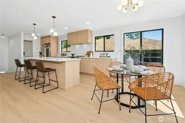 Enjoy every meal with those you hold dear in this dreamy kitchen! Lavish cabinetry, stainless appliances, quartz counters, huge island and pantry! And lots of golden accents! Ooolala!