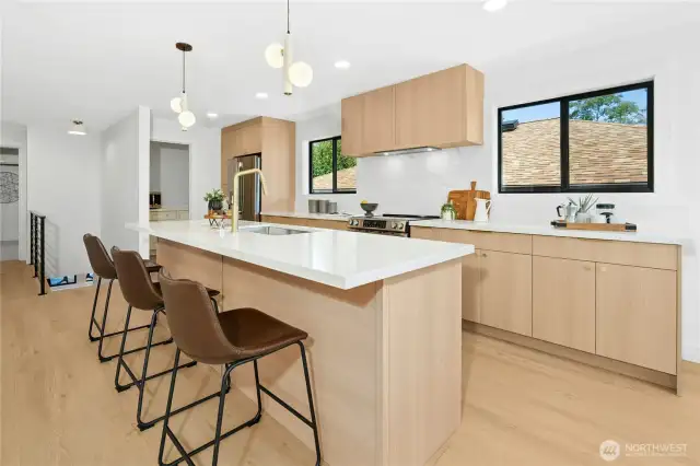 A very well-thought out design complete with an integrated vent hood to match the cabinetry. Plenty of prep space too.
