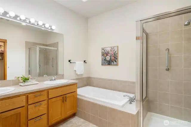 Primary bathroom with soaking tub and walk in shower.