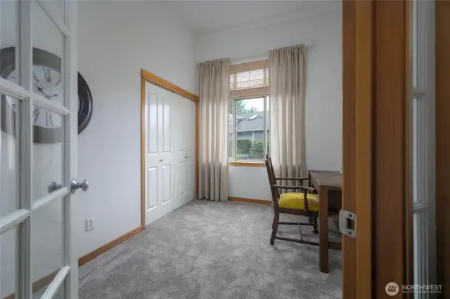 Third bedroom with glass doors.  Would make the perfect office or TV room.