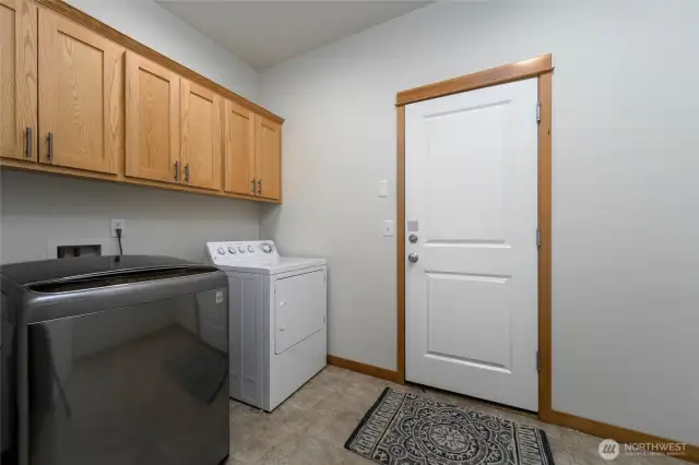 Laundry room that leads to the two car garage.