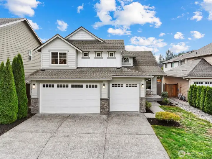 Front of 2 story craftsman home, picturesque neighborhood with No HOA! 3 car garage for more parking & storage