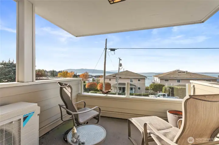 Relax on the covered deck in the afternoon while you watch the boats moving across the bay.