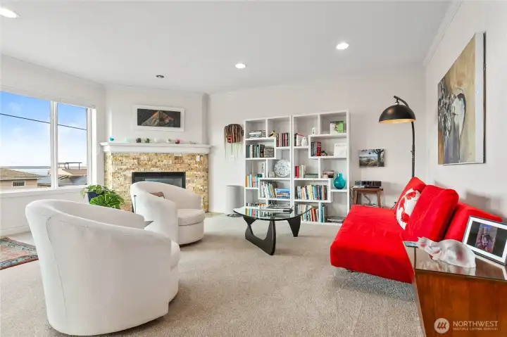 Lots of space in the living area to sit and enjoy the view, don't miss the fireplace in the corner