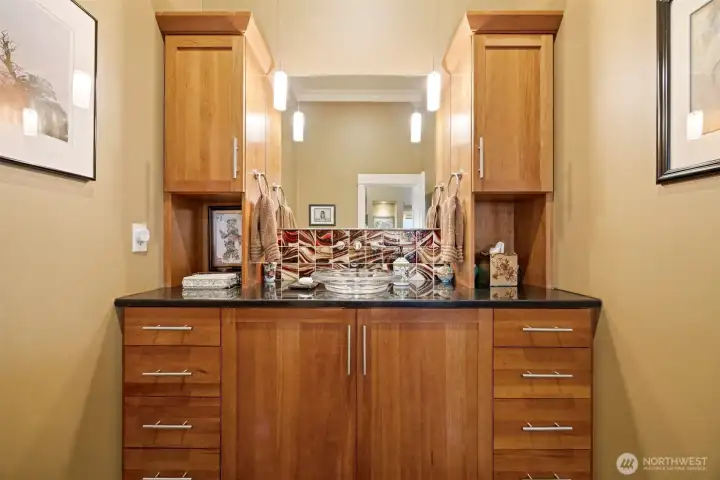 The powder room that is adjacent to the de/office has a gorgeous vanity with a vessel sink that lights up from below.