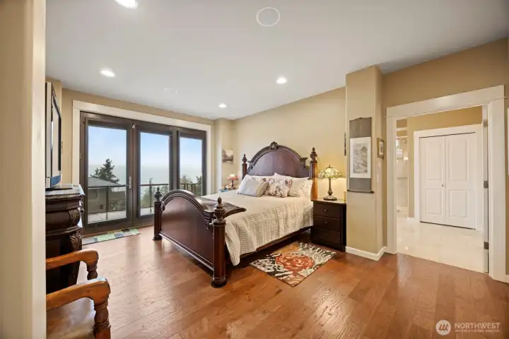 The primary bedroom is very spacious and can easily accommodate a king-size bed with two nightstands and a large dresser.