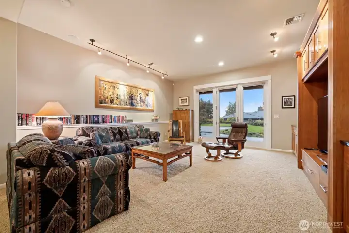 The family room is very large and opens to the covered patio that actually has bay and island views!