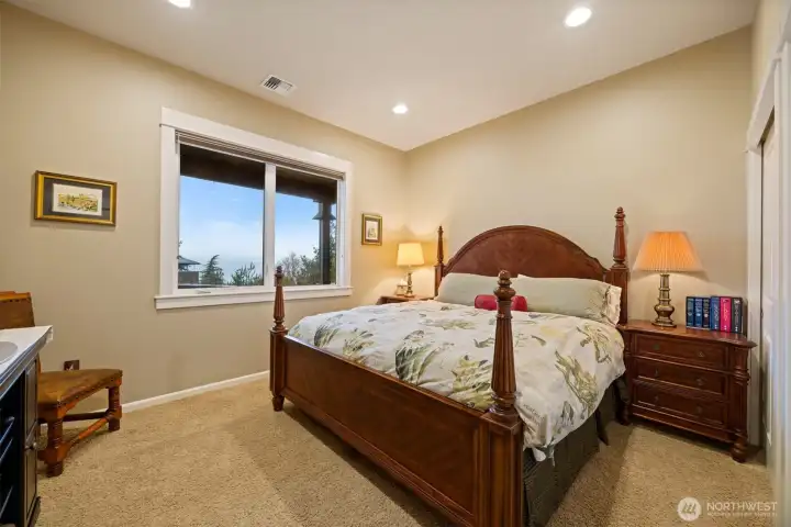 The second bedroom is also large and can accommodate a king-size bed and two nightstands along with a large dresser. It also takes in the amazing bay and island views.
